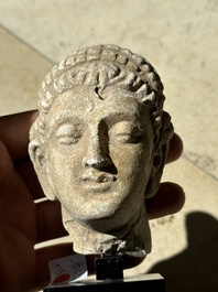 A collection of 9 Gandhara grey schist and stucco fragments of Buddha and divinities, 1/2nd C.