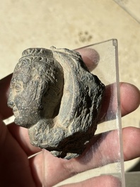 A collection of 9 Gandhara grey schist and stucco fragments of Buddha and divinities, 1/2nd C.
