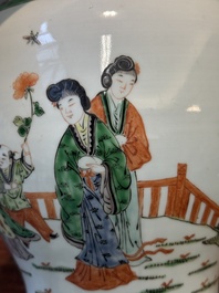 A Chinese famille verte covered vase and a bottle vase, 19th C.
