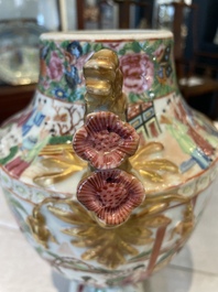 A rare pair of Chinese Canton famille rose export urns, 19th C.