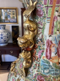 A large Chinese Canton famille rose vase and cover with narrative design, 19th C.