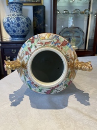 A rare pair of Chinese Canton famille rose export urns, 19th C.