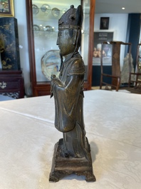 A Chinese bronze figure of an official, Ming