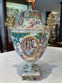A rare pair of Chinese Canton famille rose export urns, 19th C.