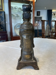 A Chinese bronze figure of an official, Ming