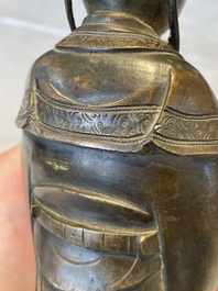A Chinese bronze figure of an official, Ming