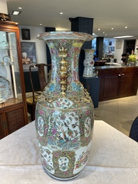A large Chinese Canton famille rose vase and cover with narrative design, 19th C.
