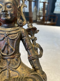 A Chinese bronze Bodhisattva on stand, Yongle mark, dated 1422