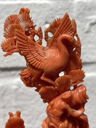 A Chinese red coral group of Shoulao with two boys holding a peach, inscribed 'Shou Bi Nan Shan 壽比南山', 19/20th C.