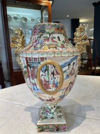 A rare pair of Chinese Canton famille rose export urns, 19th C.
