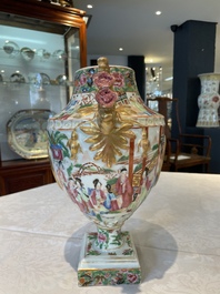 A rare pair of Chinese Canton famille rose export urns, 19th C.