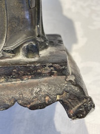 A Chinese bronze figure of an official, Ming