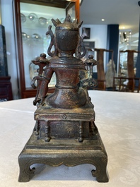 A Chinese bronze Bodhisattva on stand, Yongle mark, dated 1422