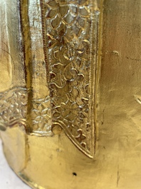 A large Sino-Tibetan gilt bronze Buddha on wooden stand, Ming