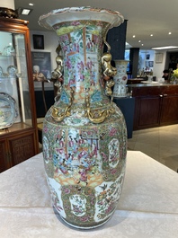 A large Chinese Canton famille rose vase and cover with narrative design, 19th C.