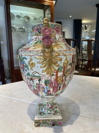 A rare pair of Chinese Canton famille rose export urns, 19th C.