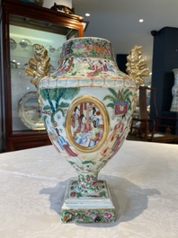 A rare pair of Chinese Canton famille rose export urns, 19th C.