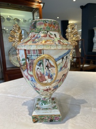 A rare pair of Chinese Canton famille rose export urns, 19th C.