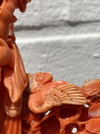 A Chinese red coral group of Shoulao with two boys holding a peach, inscribed 'Shou Bi Nan Shan 壽比南山', 19/20th C.