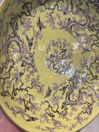 A Chinese yellow-ground famille rose 'magpie and plum tree' plate, Tongzhi mark and of the period