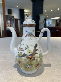 A pair of Chinese blue and white vases, a pair of sancai Buddhist lions, a famille rose ewer and a teapot, 19th C.