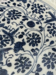 A pair of Chinese blue and white plates with floral design and reticulated border, conical shell mark, Kangxi