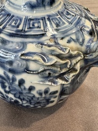 A fine Chinese blue and white 'pomegranate' kendi and a wooden cover, Wanli