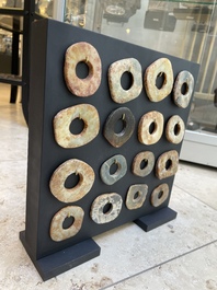 A collection of 16 Chinese neolithic jade 'bi' discs, probably Shang