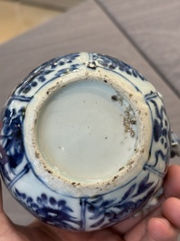 A fine Chinese blue and white 'pomegranate' kendi and a wooden cover, Wanli