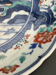 A Japanese Hizen ware Kakiemon-style 'riverside landscape' plate, Edo, 17/18th C.