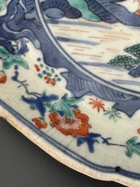 A Japanese Hizen ware Kakiemon-style 'riverside landscape' plate, Edo, 17/18th C.