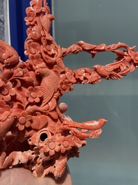 A Chinese red coral group of birds among flowering branches, 19/20th C.