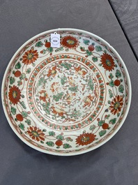 A Chinese red-and-green-enamelled 'chrysanthemum scroll' dish, Ming