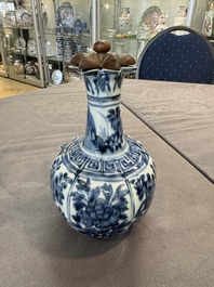 A fine Chinese blue and white 'pomegranate' kendi and a wooden cover, Wanli