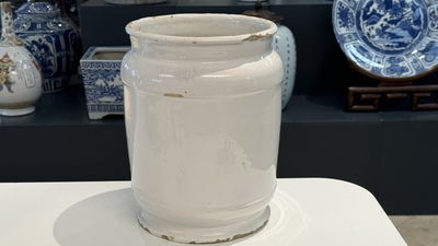 A large Dutch Delft blue and white albarello, inscribed 'Corenten', 18th C.