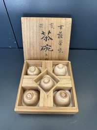 A Japanese blue and white gourd vase, an Imari bottle vase and a set of five Satsuma cups, 19th C.