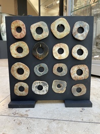 A collection of 16 Chinese neolithic jade 'bi' discs, probably Shang