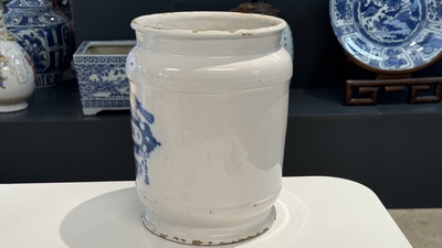 A large Dutch Delft blue and white albarello, inscribed 'Corenten', 18th C.