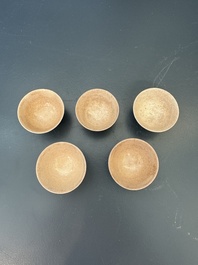 A Japanese blue and white gourd vase, an Imari bottle vase and a set of five Satsuma cups, 19th C.