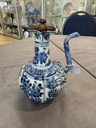 A fine Chinese blue and white 'pomegranate' kendi and a wooden cover, Wanli