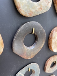 A collection of 16 Chinese neolithic jade 'bi' discs, probably Shang