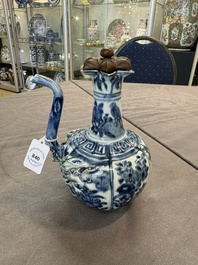 A fine Chinese blue and white 'pomegranate' kendi and a wooden cover, Wanli