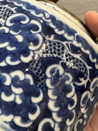 A Chinese polished purple Yixing stoneware covered teapot for the Thai market and a blue and white covered teapot, 19th C.