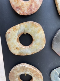 A collection of 16 Chinese neolithic jade 'bi' discs, probably Shang