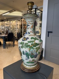 A Chinese famille verte vase, two famille rose jars and three covered jars, 19th C.