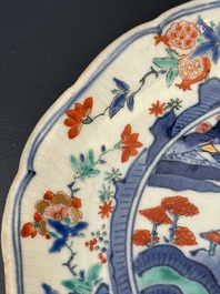A Japanese Hizen ware Kakiemon-style 'riverside landscape' plate, Edo, 17/18th C.