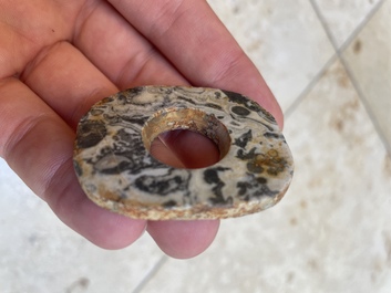 A collection of 16 Chinese neolithic jade 'bi' discs, probably Shang
