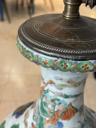 A Chinese famille verte vase, two famille rose jars and three covered jars, 19th C.