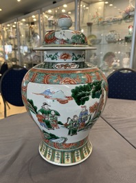 A pair of Chinese famille verte 'Wen Wang Fang Xian 文王訪賢' vases and covers, 19th C.
