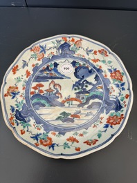 A Japanese Hizen ware Kakiemon-style 'riverside landscape' plate, Edo, 17/18th C.